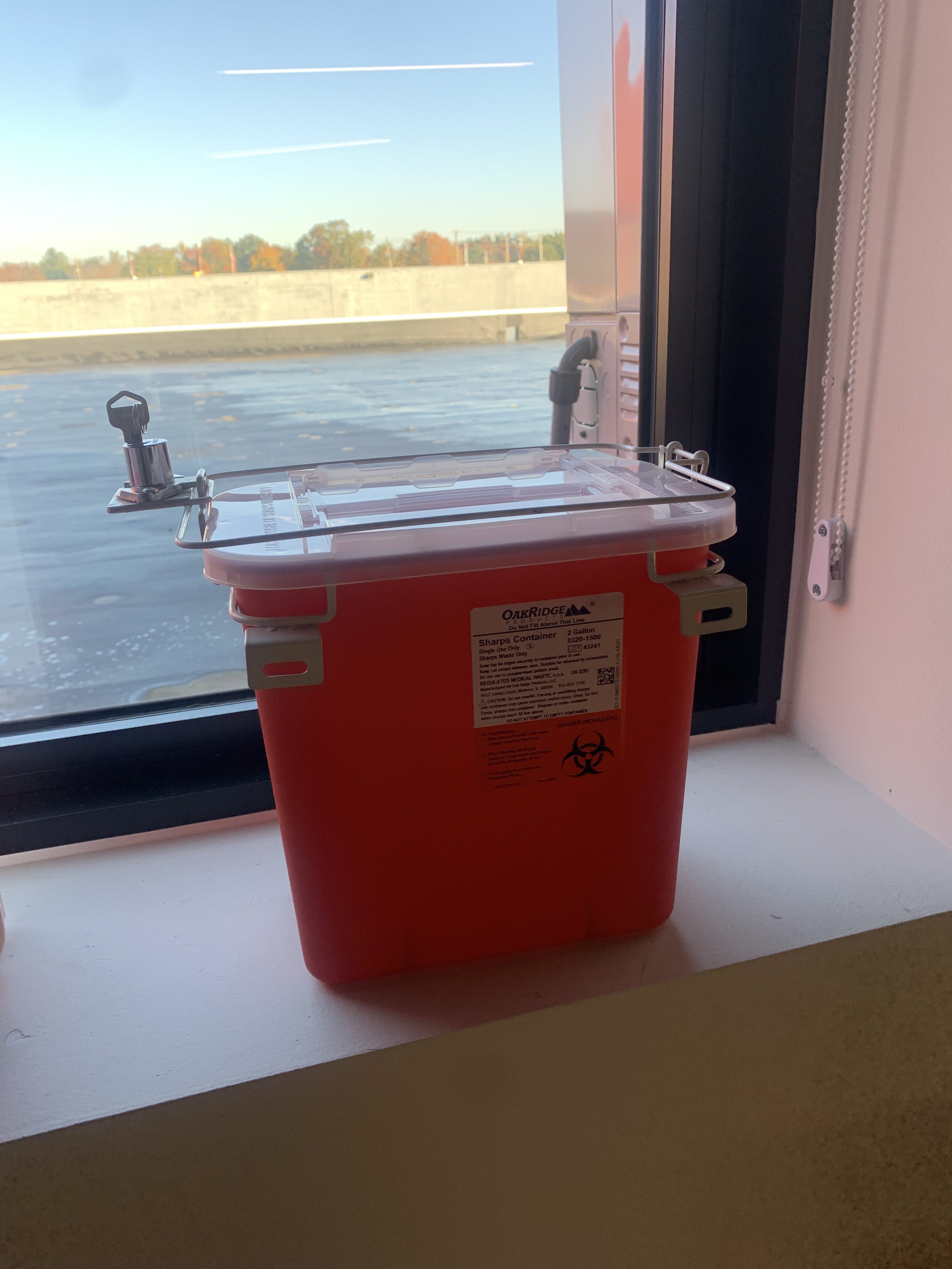 MedXWaste biohazard containers and medical waste disposal products on display