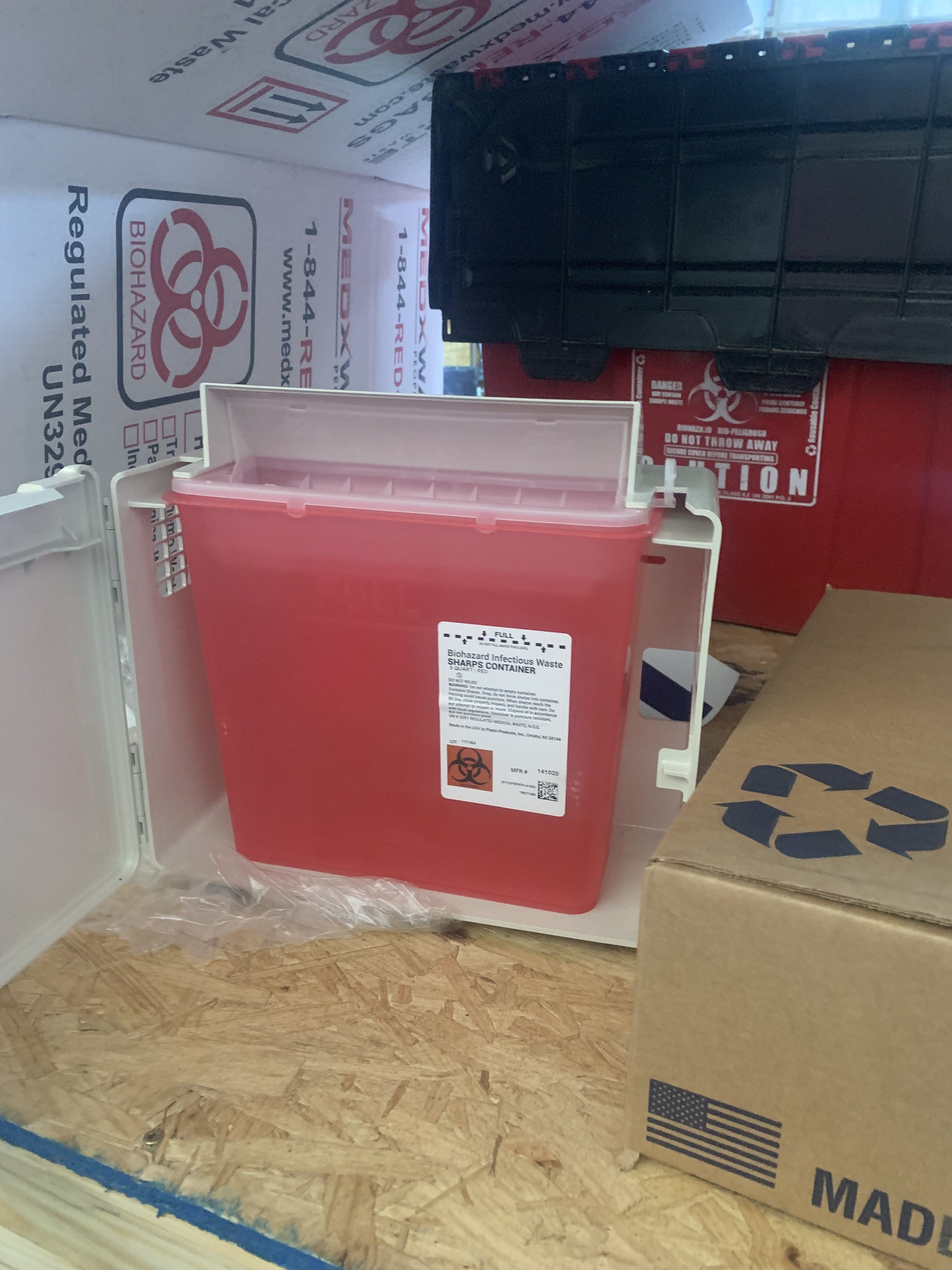 MedXWaste biohazard containers and marketing materials at trade show display
