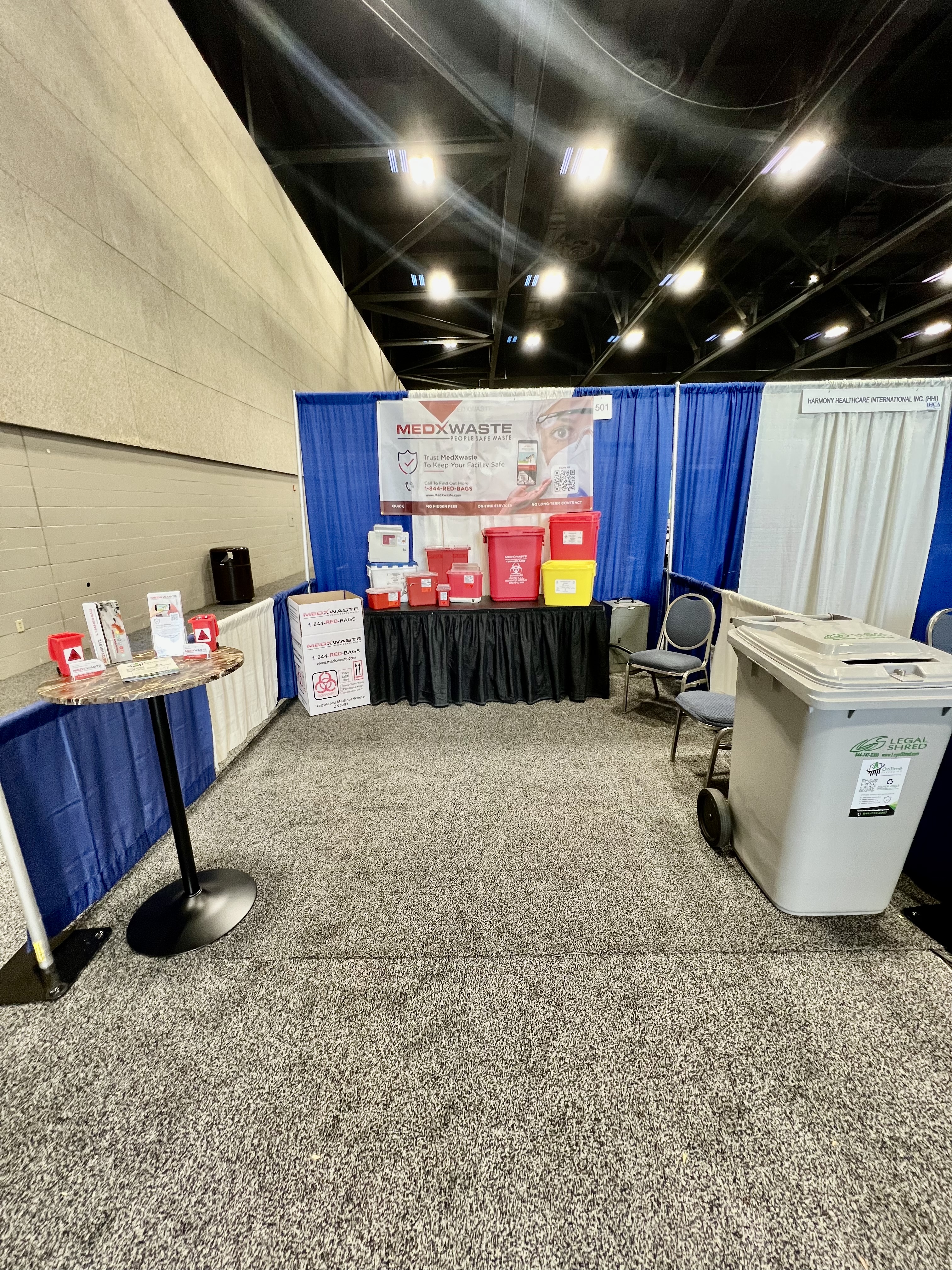 MedXWaste OnTime Shredding trade show booth with sharps and biohazard containers